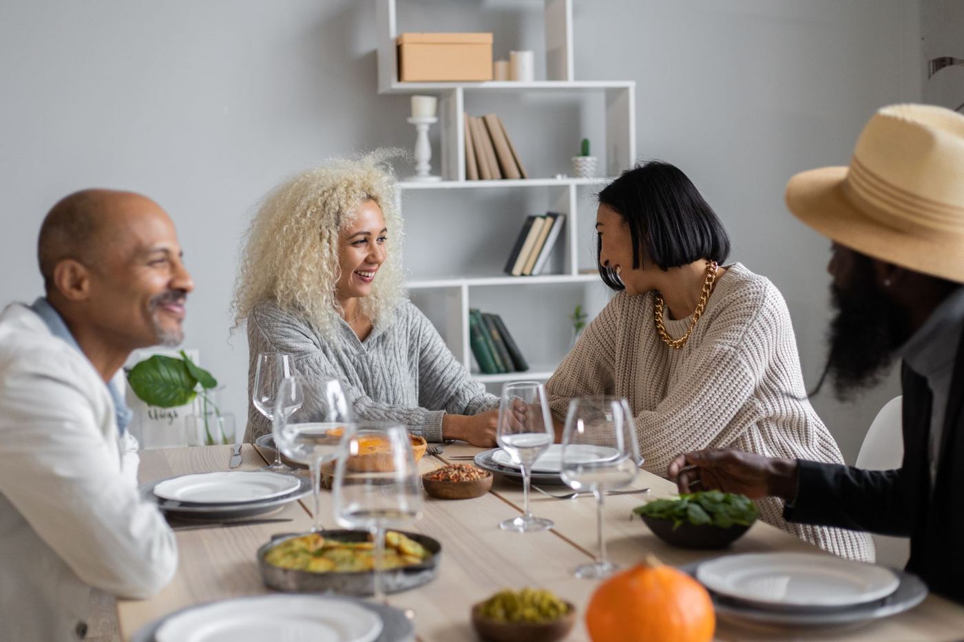 People sharing a conversation and connecting with one another around a table